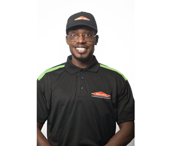 male, black servpro uniform top, glasses