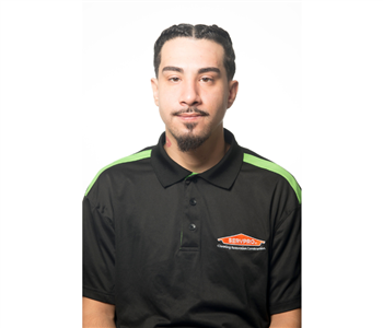 smiling male , goateau, black servpro shirt